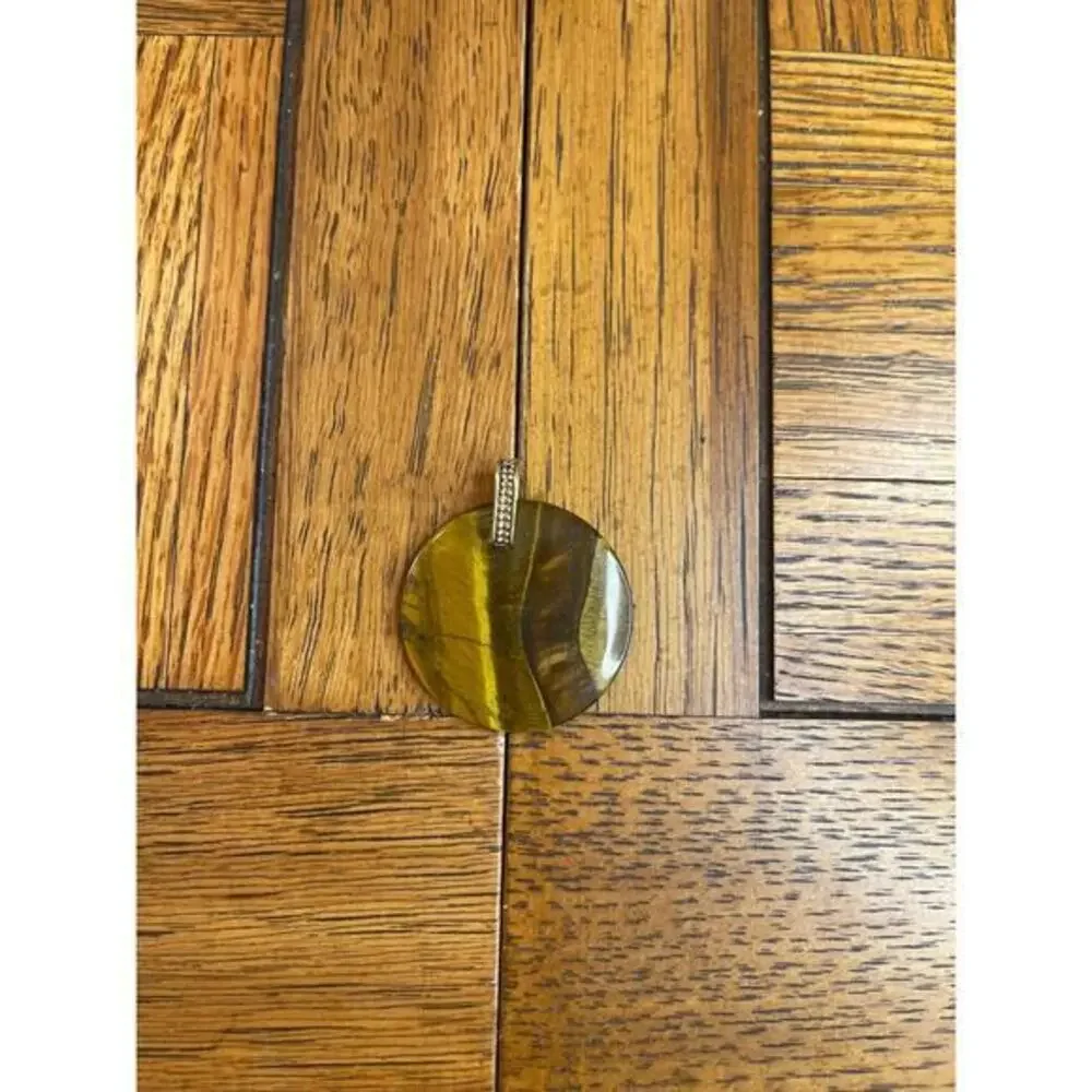 Polished tigers eye pendant